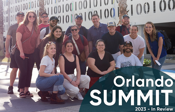 playfair data group photo in front of code wall art installation in lake nona florida for their 2023 orlando team summit
